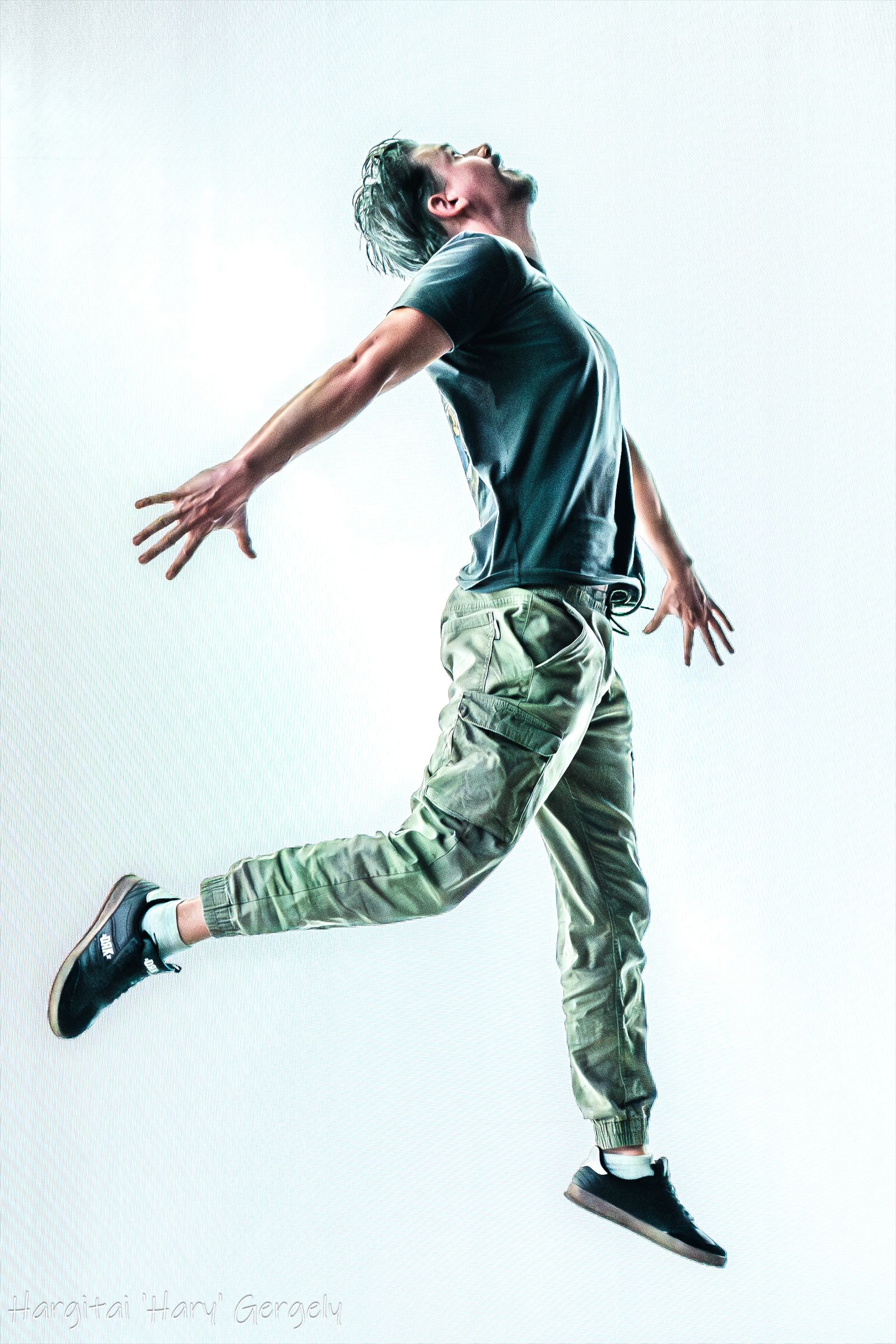 Actor mid-jump against a white plate background