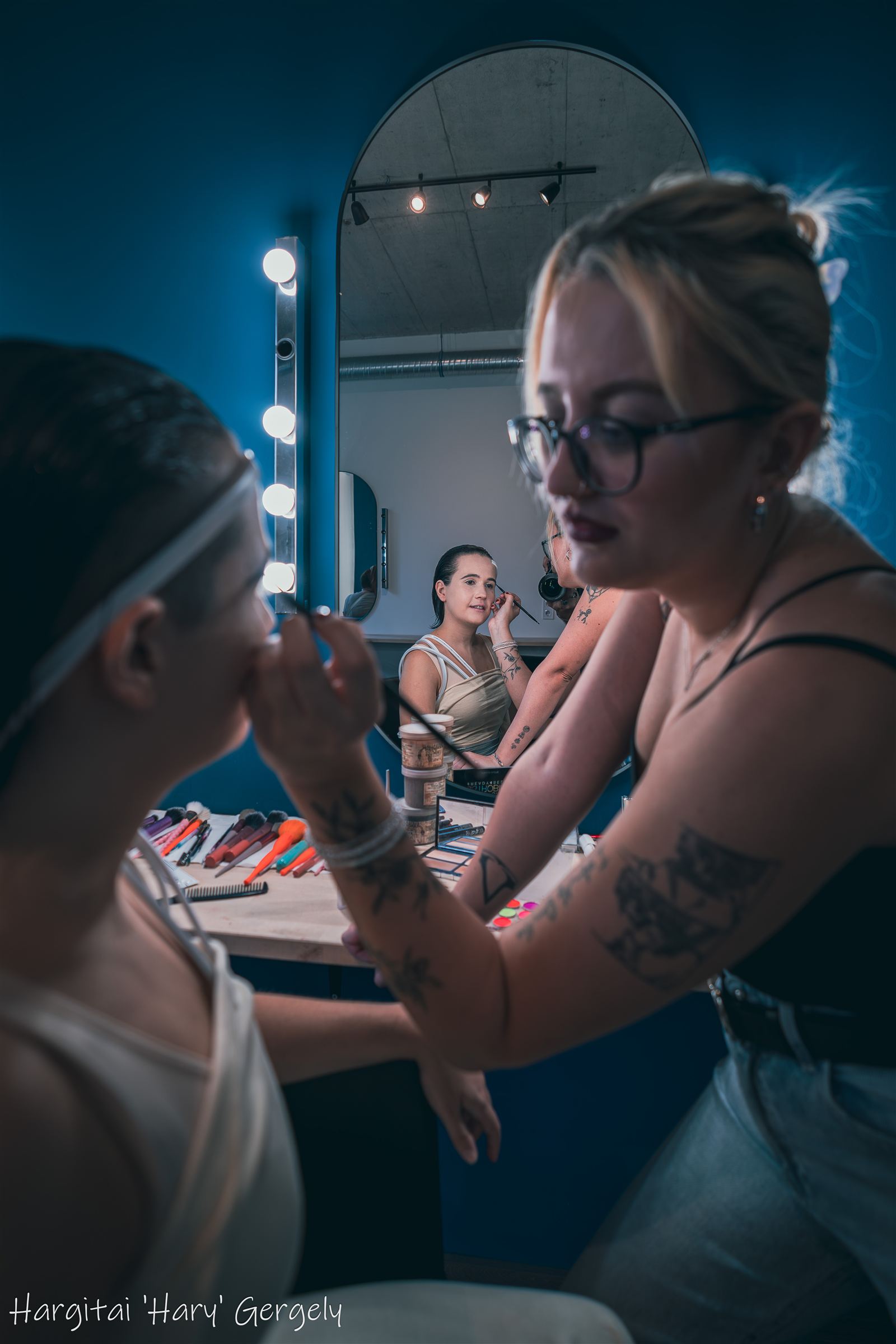 Make-up artists working in the mirror room